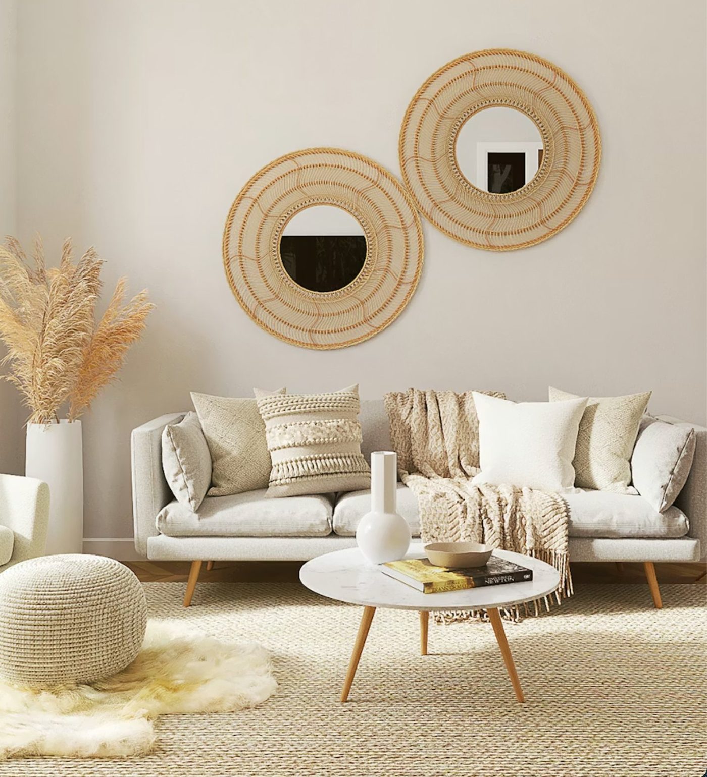 A bright Ibizan villa terrace with wicker chairs and a view of the Mediterranean.
