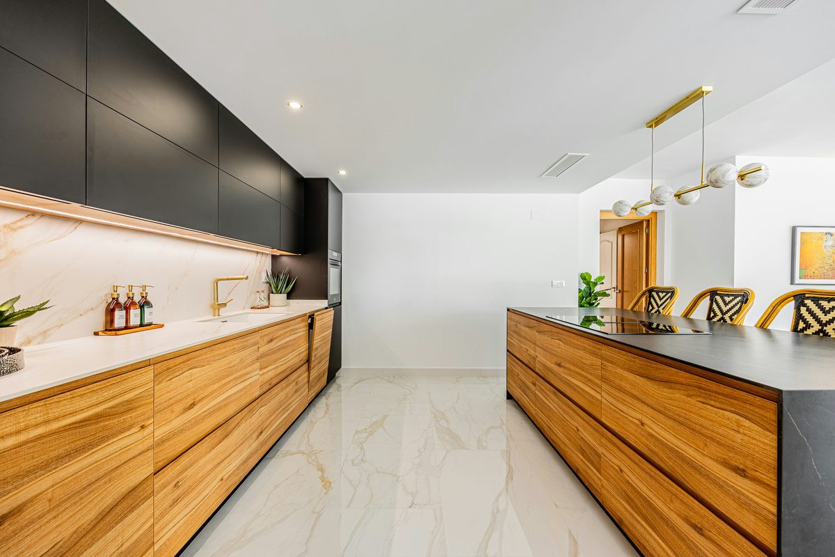 A meticulously cleaned and reset Mediterranean kitchen, every surface gleaming.